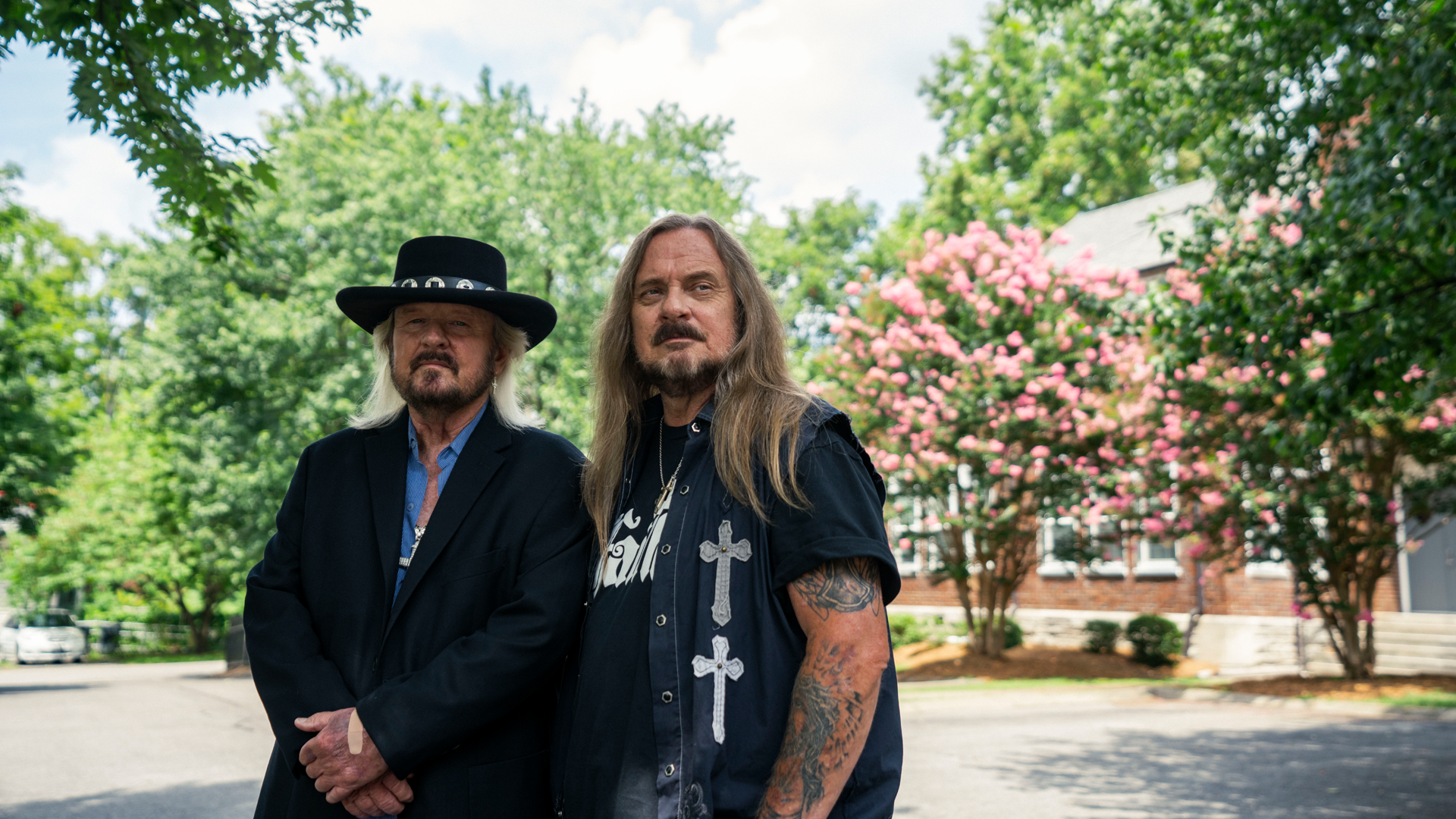 Van Zant members standing together outside